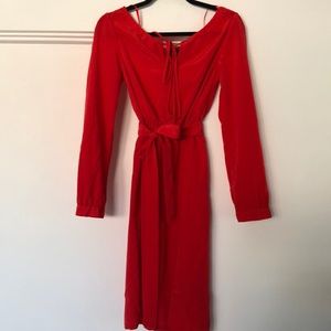 Knee length, off shoulders, long sleeves dress.